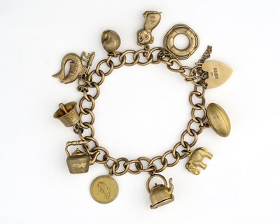 Lot 483 - A 9ct gold charm bracelet