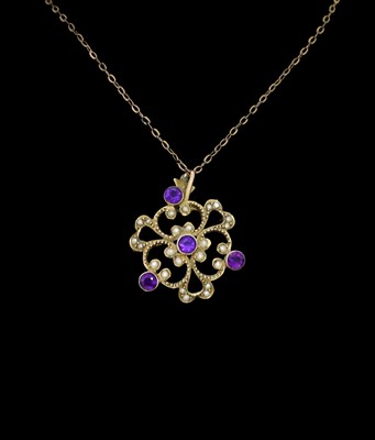 Lot 9 - An Edwardian 9ct gold amethyst and split pearl pendant, with chain