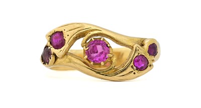 Lot 442 - A synthetic ruby openwork scroll ring
