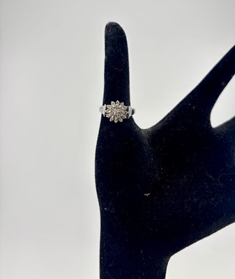 Lot 484 - An 18ct white gold diamond cluster dress ring