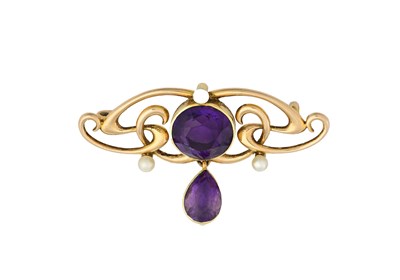 Lot 6 - An Edwardian gold amethyst and seed pearl scrolling brooch, AF