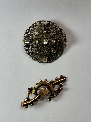 Lot 454 - An early 20th century 9ct gold bar brooch and a costume paste brooch