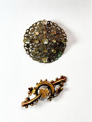 Lot 454 - An early 20th century 9ct gold bar brooch and a costume paste brooch