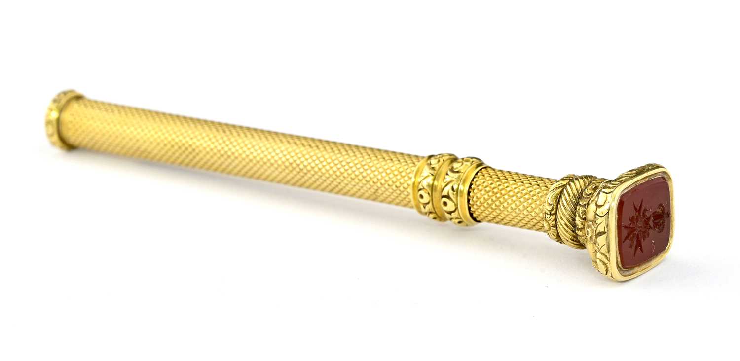 Lot 45 - A 19th century gold retractable pencil with carnelian intaglio terminal
