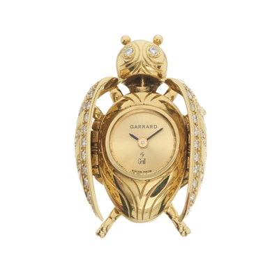Lot 237 - GMT, for Garrard, a diamond set 18ct gold novelty fob watch