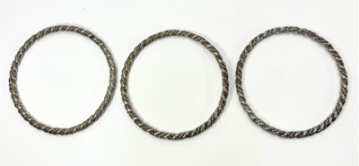Lot 431 - Three twisted design bangles