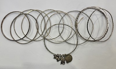 Lot 430 - A large selection of silver and white metal bangles