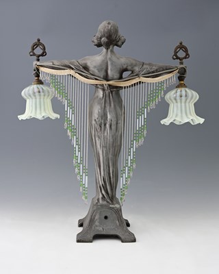 Lot 84 - An Art Nouveau art metal figural table lamp,...