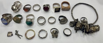 Lot 408 - A selection of mainly silver and white metal rings and an early 20th century charm bangle