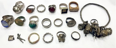 Lot 408 - A selection of mainly silver and white metal rings and an early 20th century charm bangle