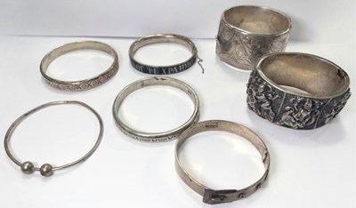 Lot 405 - A selection of silver and white metal bangles