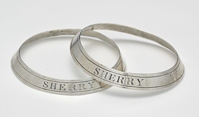 Lot 213 - A pair of George III unmarked silver bottle...