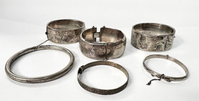 Lot 250 - A selection of mostly silver bangles