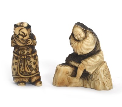 Lot 371 - A Japanese stag horn netsuke of a figure...