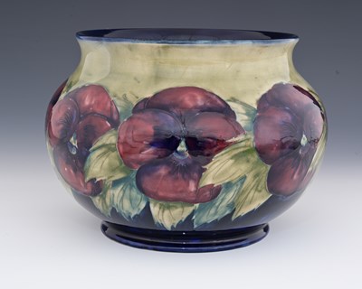 Lot 553 - William Moorcroft, a large Pansy jardiniere,...