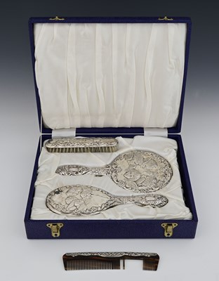 Lot 142 - A cased Elizabeth II silver-mounted dressing...