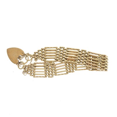 Lot 103 - A 1970s 9ct gold gate bracelet, with 9ct gold...