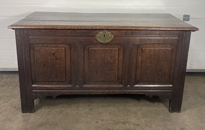 Lot 597 - An 18th century oak coffer with three plank...