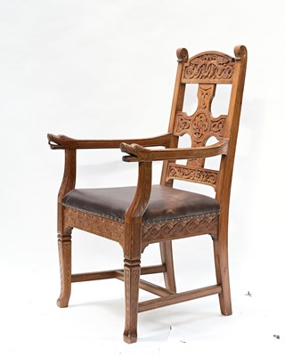 Lot 328 - An Arts and Crafts Iona style carved pine...