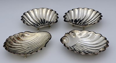 Lot 271 - Four twentieth-century silver-coloured metal...