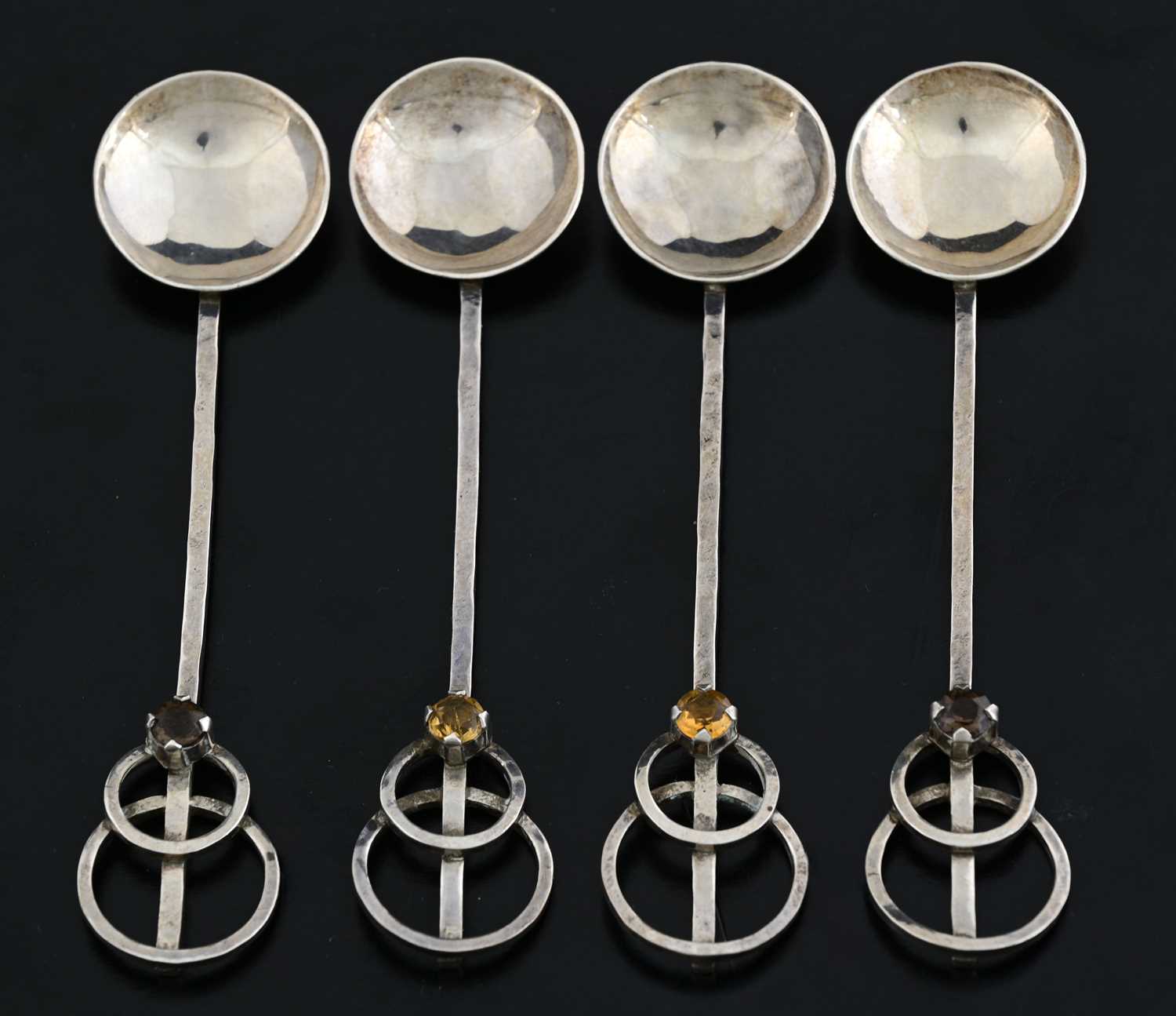 Lot 63 - Four Arts and Crafts silver and gem set spoons,...