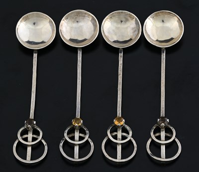 Lot 63 - Four Arts and Crafts silver and gem set spoons,...