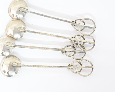 Lot 63 - Four Arts and Crafts silver and gem set spoons,...