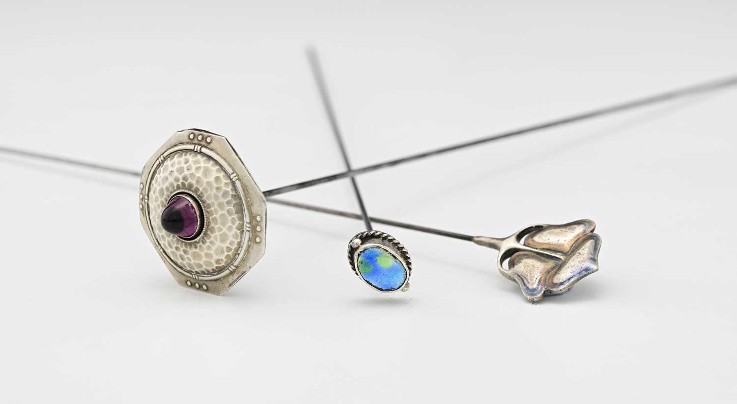 Lot 58 - Three Arts and Crafts hat pins, including a...
