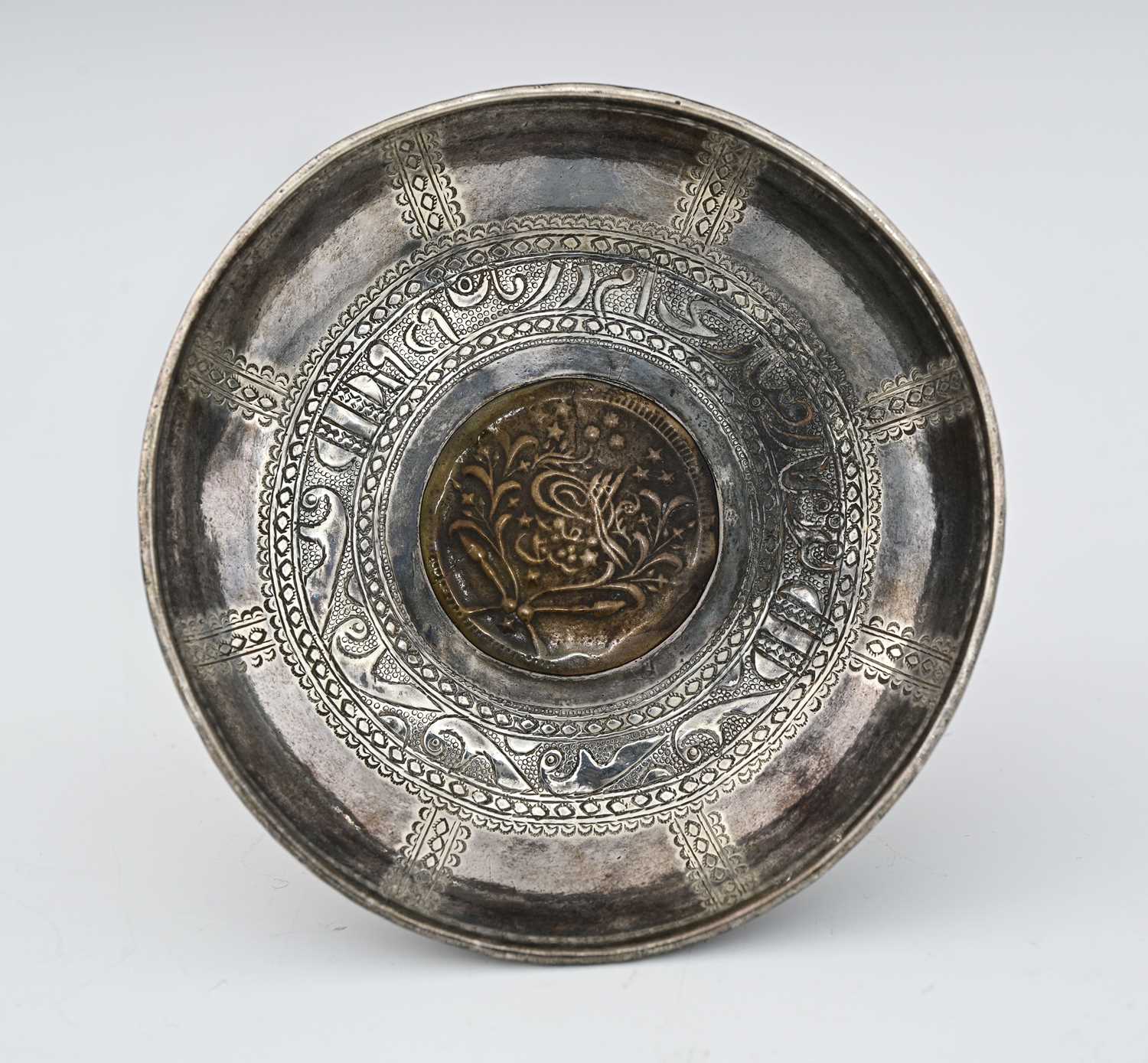 Lot 47 - An Ottoman silver and coin set dish, incised...