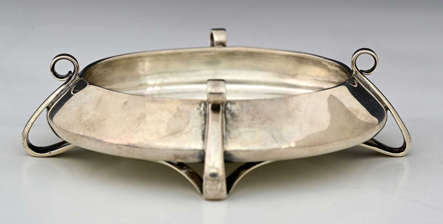 Lot 54 - Oliver Baker for Liberty and Co., a Cymric...