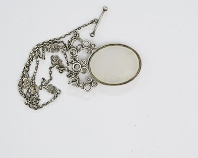 Lot 28 - An Arts and Crafts silver and agate necklace,...