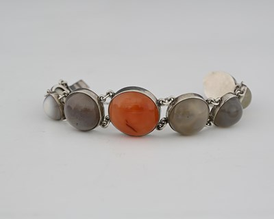 Lot 29 - An Arts and Crafts agate and silver bracelet,...