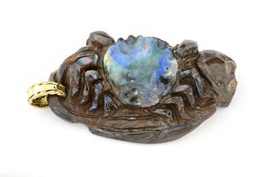 Lot 27 - An Arts and Crafts carved boulder opal pendant,...