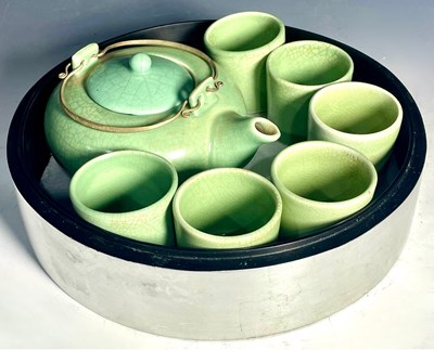 Lot 224 - A Chinese Celadon glazed squat form teapot...