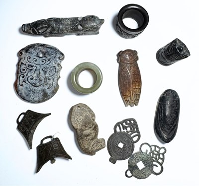 Lot 283 - A collection of carved hardstone jade/nephrite-...