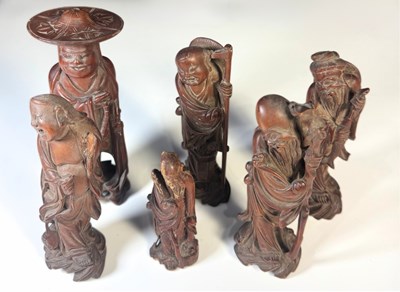 Lot 281 - A small collection of Chinese carved hardwood...