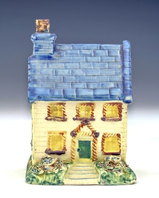 Lot 630 - A Leeds Pottery model of a two-story cottage,...