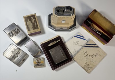 Lot 279 - A hallmarked silver matchbox cover, engine...