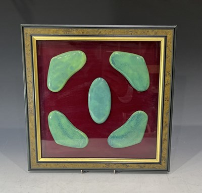 Lot 205 - A framed collection of five green souffle...