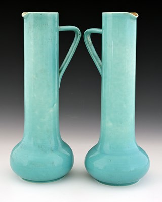 Lot 567 - A pair of Art Pottery ewers, Burmantofts style...