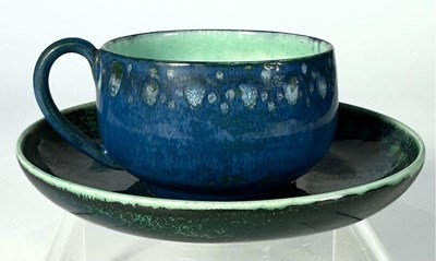 Lot 198 - A Ruskin blue soufflé cup and saucer with...