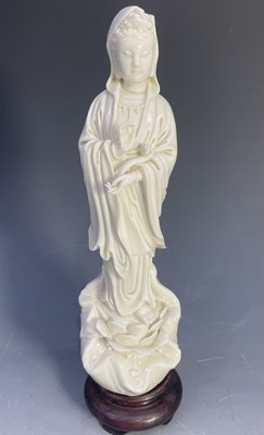 Lot 231 - A blanc de chine porcelain figure of Guanyin...
