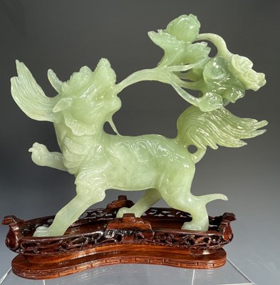 Lot 225 - An intricately carved large jade-type green...