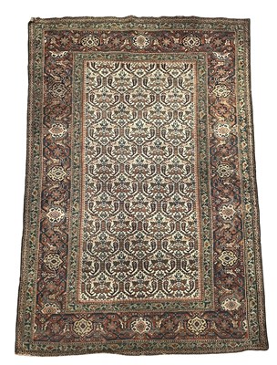 Lot 647 - A Persian hand-knotted wool carpet or rug,...