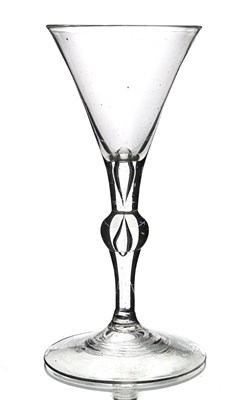 Lot 382 - A Dutch light baluster wine glass, circa 1720,...
