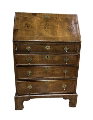 Lot 606 - A small George I style walnut, or other native...