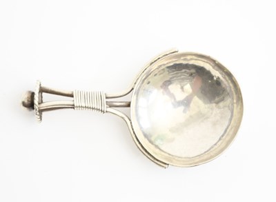 Lot 521 - An A E Jones silver tea caddy spoon, the...