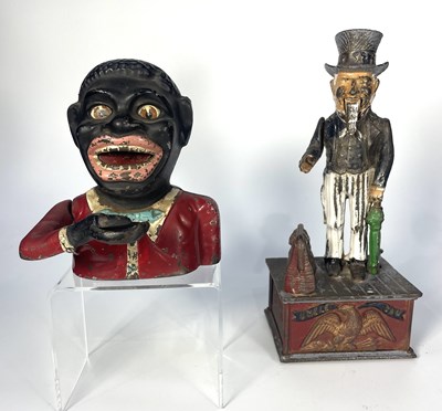 Lot 339 - A cast iron mechanical money box, modelled as...