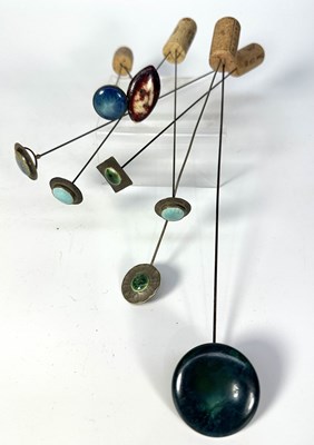 Lot 191 - A collection of white metal hat pins set with...