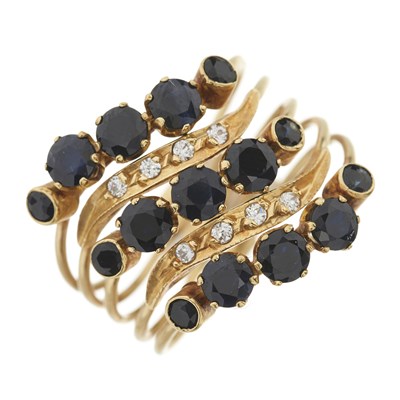 Lot 92 - A sapphire and cubic zirconia alternating five band ring